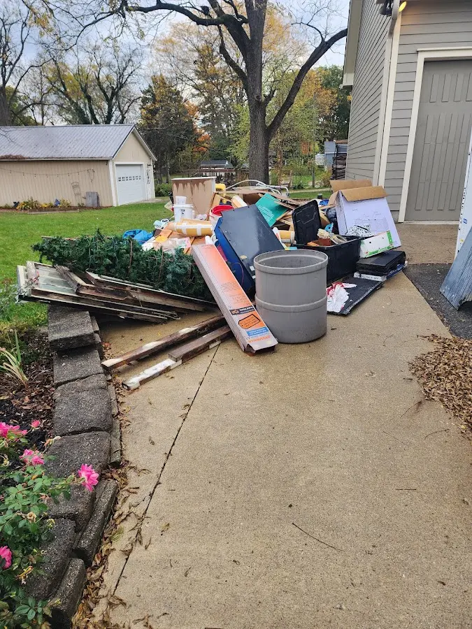 Dumpster being loaded with debris for 3 Yard Dumpster Rental in Englewood